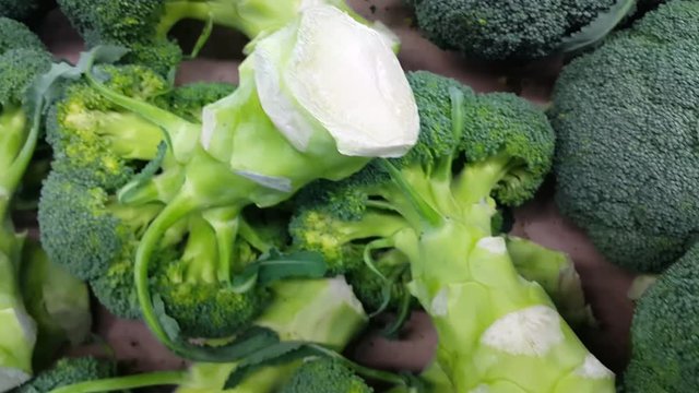 4K Vegetable background: Broccoli cabbage  green pile in supermarket. It is full of vitamins, minerals, fiber and antioxidants.