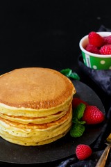 Close up of homemade fluffy pancakes stack, selective focus