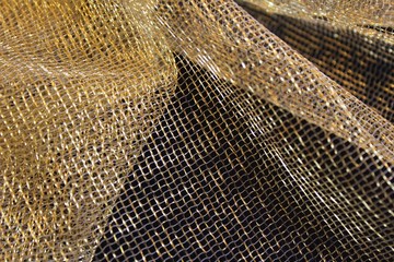 Gold colored mesh fabric