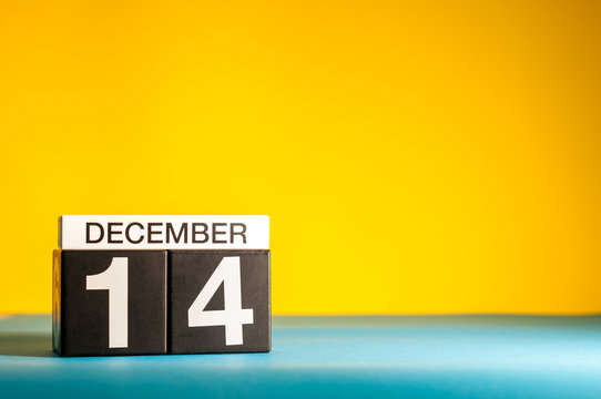 December 14th. Image 14 day of december month, calendar on yellow background with empty space for text