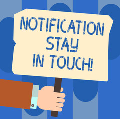 Writing note showing Notification Stay In Touch. Business photo showcasing Do not forget to be connected Social networks Hu analysis Hand Holding Colored Placard with Stick Text Space