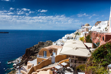 Scenic view of sea with restaurant and traditional houses; Santorini; Greece