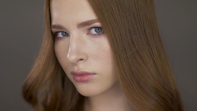 Cute young model poses for the camera. She is looking at the camera