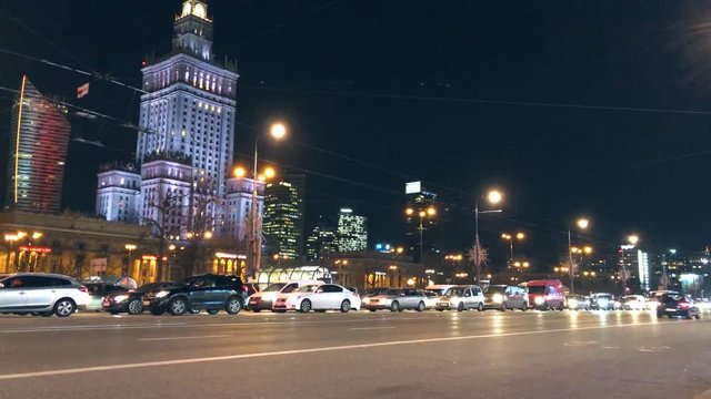 Night city traffic in the center of Warsaw near the Palace of Science and Culture, Poland