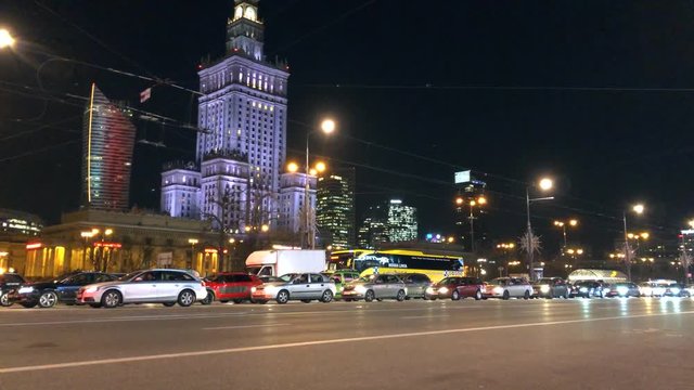 Night city traffic in the center of Warsaw near the Palace of Science and Culture, Poland