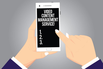 Handwriting text writing Video Content Management Service. Concept meaning Marketing advertising optimization strategy Hu analysis Hands Holding Pointing Touching Smartphone Blank Color Screen