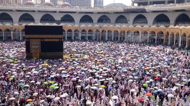 Circumambulation with umbrellas (Tawaf) around 'Holy Kaaba', in Mecca