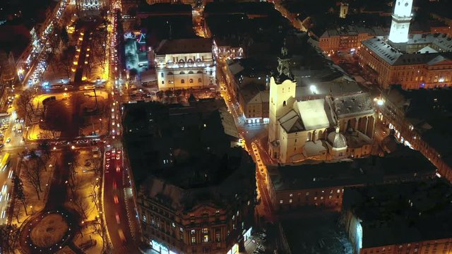 Hyperlapse of night city traffic in the historical center of Lviv, UNESCO's cultural heritage. Aerial view.