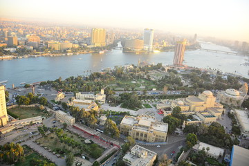  Nile river in Cairo Egypt during the day with boats running and high building surrounding river banks