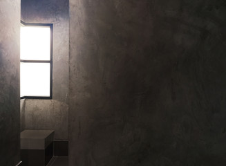 Background inside a dark room with light from a mirror and empty space for text .