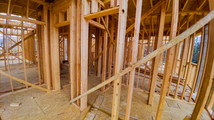 Residential home framing view on new house wooden under construction