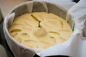 Delicious pear tart on table. Homemade organic fresh pear fruit pie or tart backed. Cooking process.