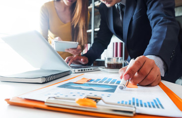 Business team present. professional investor working new start up project. Finance managers meeting.using smart phone and laptop and digital tablet computer in modern office.