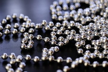 Silver Christmas decoration on a dark background close up