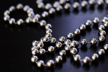 Silver Christmas decoration on a dark background close up