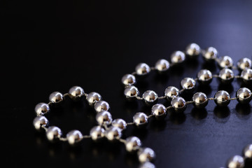 Silver Christmas decoration on a dark background close up