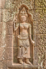 Apsara relief on the wall of the Vat Phou temple complex sanctuary