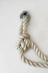 nautical knots tied by the rope of a rope on white background