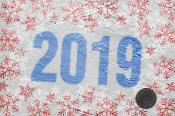 Winter ice arena and hockey puck