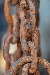 Rusty chains eroded by sea water