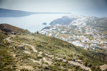 Fototapeta na wymiar View of hill with Oia town and Santorini island; Greece