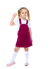 Naklejka premium Little girl posing in studio on a white background.