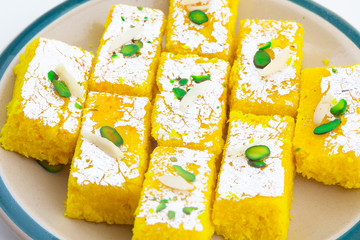 Indian Popular Sweet Food Khopara Pak or Coconut Burfi made up of Coconut, Milk And Sugar Isolated on White Background