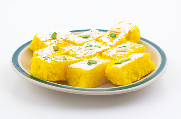 Indian Popular Sweet Food Khopara Pak or Coconut Burfi made up of Coconut, Milk And Sugar Isolated on White Background