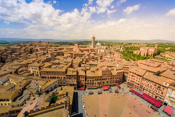 Piazza del Campo, Siena - Aerial view of the historic town with beautiful landscape scenery on a sunny summer day in Tuscany, walled medieval hill town with towers in the province of Siena, Italy