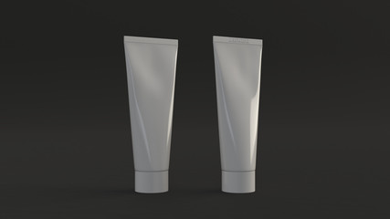 Pair of blank white tubes of toothpaste, cream or gel