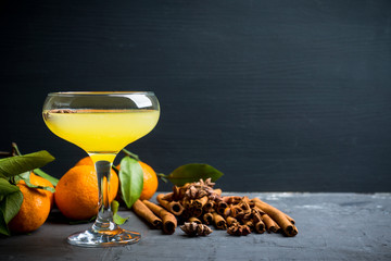 Citrus beverage with spices in margarita glass. Selective focus. Shallow depth of field. 