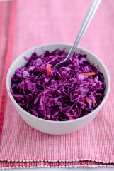 Obraz na płótnie Canvas Fork on bowl with purple sauerkraut