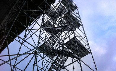 Temporary scaffolding and stairs on construction site.