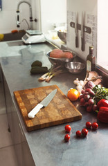 Obraz na płótnie Canvas Cooking ingredients for salad and kitchen utensils