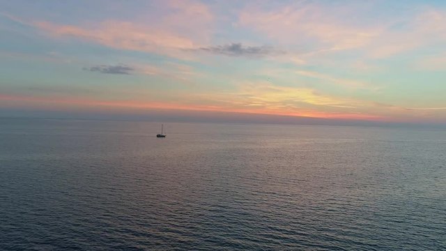 Boat at sea. Sunset time. Aerial view