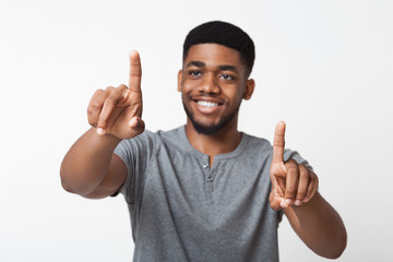 Black man touching on transparent screen interface