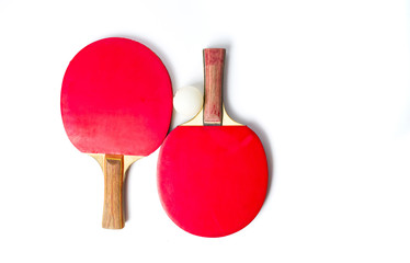 Two table tennis rackets and a ball isolated