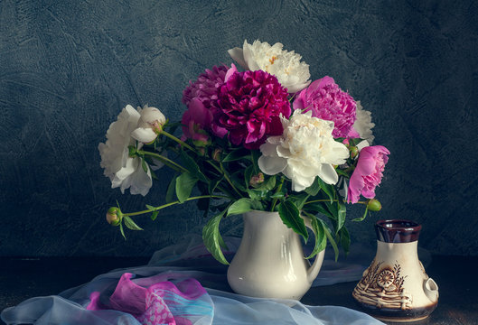 Still life with white and pink peonies.