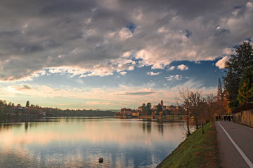 Panoramic view of the promenade along the Ticino river in the sunset