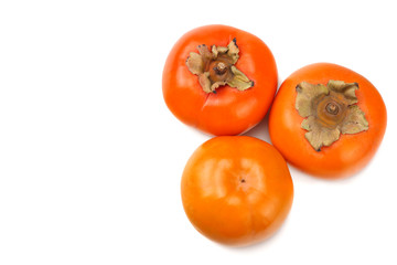 fresh ripe persimmons isolated on white background. top view