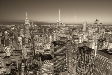 Fototapeta na wymiar NEW YORK CITY - DECEMBER 7, 2018: Night lights of Midtown Manhattan skyscrapers. The city attracts 50 million people annually