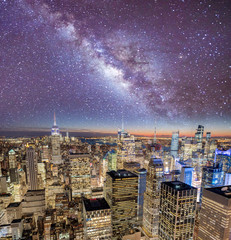 Night lights of Midtown Manhattan skyscrapers. Sunset aerial view of New York City buildings and skyline