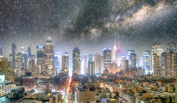 Midtown Manhattan aerial view at night as seen from Hell's Kitchen rooftop with starry night
