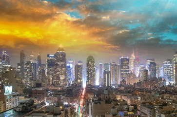 Fototapeta na wymiar Midtown Manhattan aerial view at night as seen from Hell's Kitchen rooftop