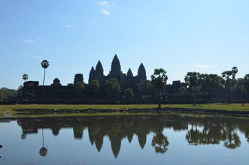 Fototapeta na wymiar The Angkor Wat temple with five towers is reflected in the lake. Angkor, Cambodia.