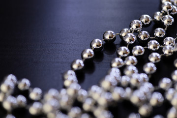 Silver Christmas decoration on a dark background close up