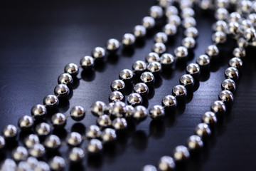 Silver Christmas decoration on a dark background close up