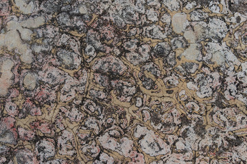 Aged cracked concrete stone plaster wall background and texture style, Closeup fragment of grunge weathered wall of a building,