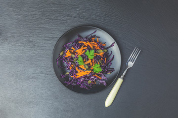 Salad of purple cabbage, carrots pumpkin seeds and parsley