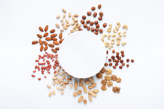 Assortment of scattered nuts in circle with copy space